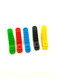 Five colorful plastic LEGO bottle openers on a white background