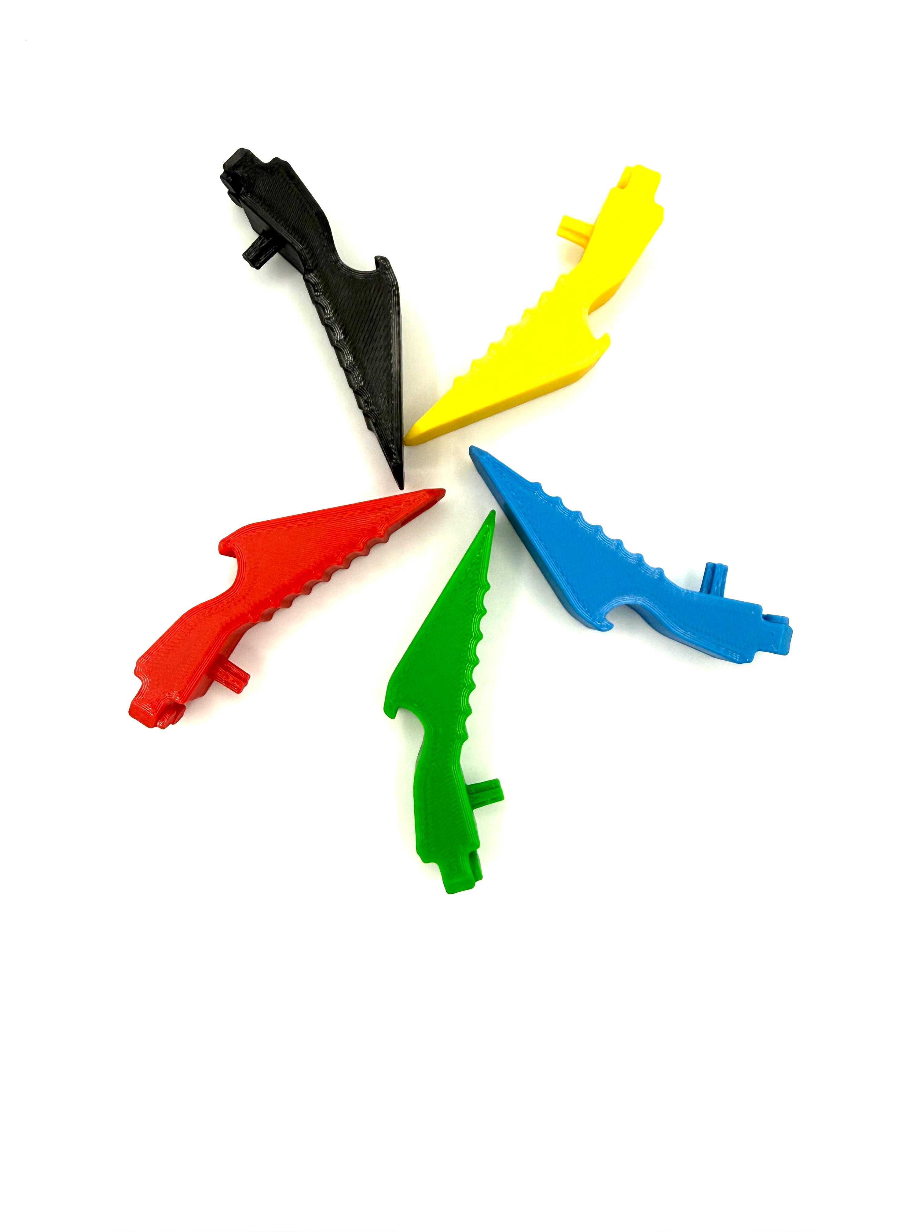 Five colorful plastic LEGO bottle openers on a white background