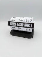 Calendar roll with black holder on a white background