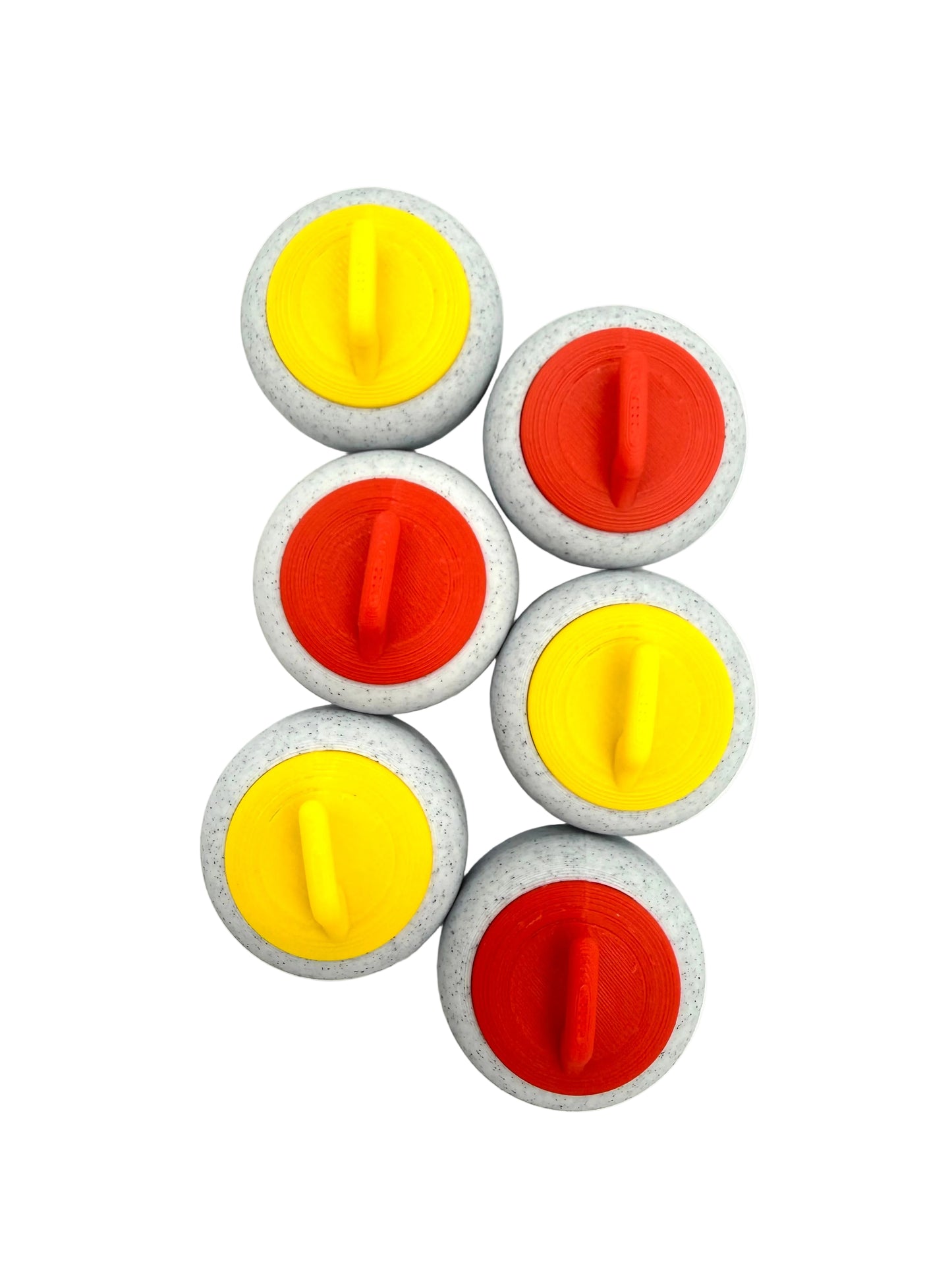 Set of six round curling stone magnets with red and yellow centers on a white background
